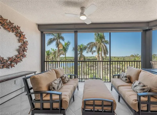 a balcony with furniture and window