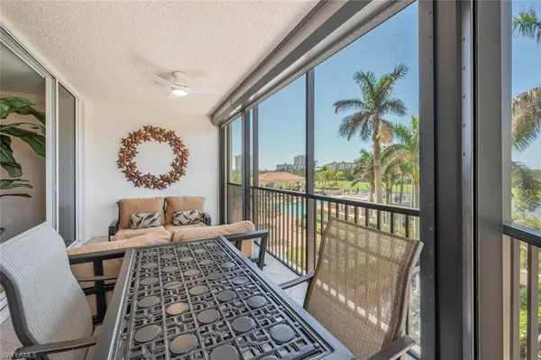 a balcony with furniture and rug