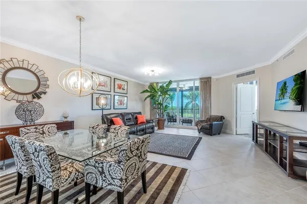 a view of a dining room with furniture window and outside view