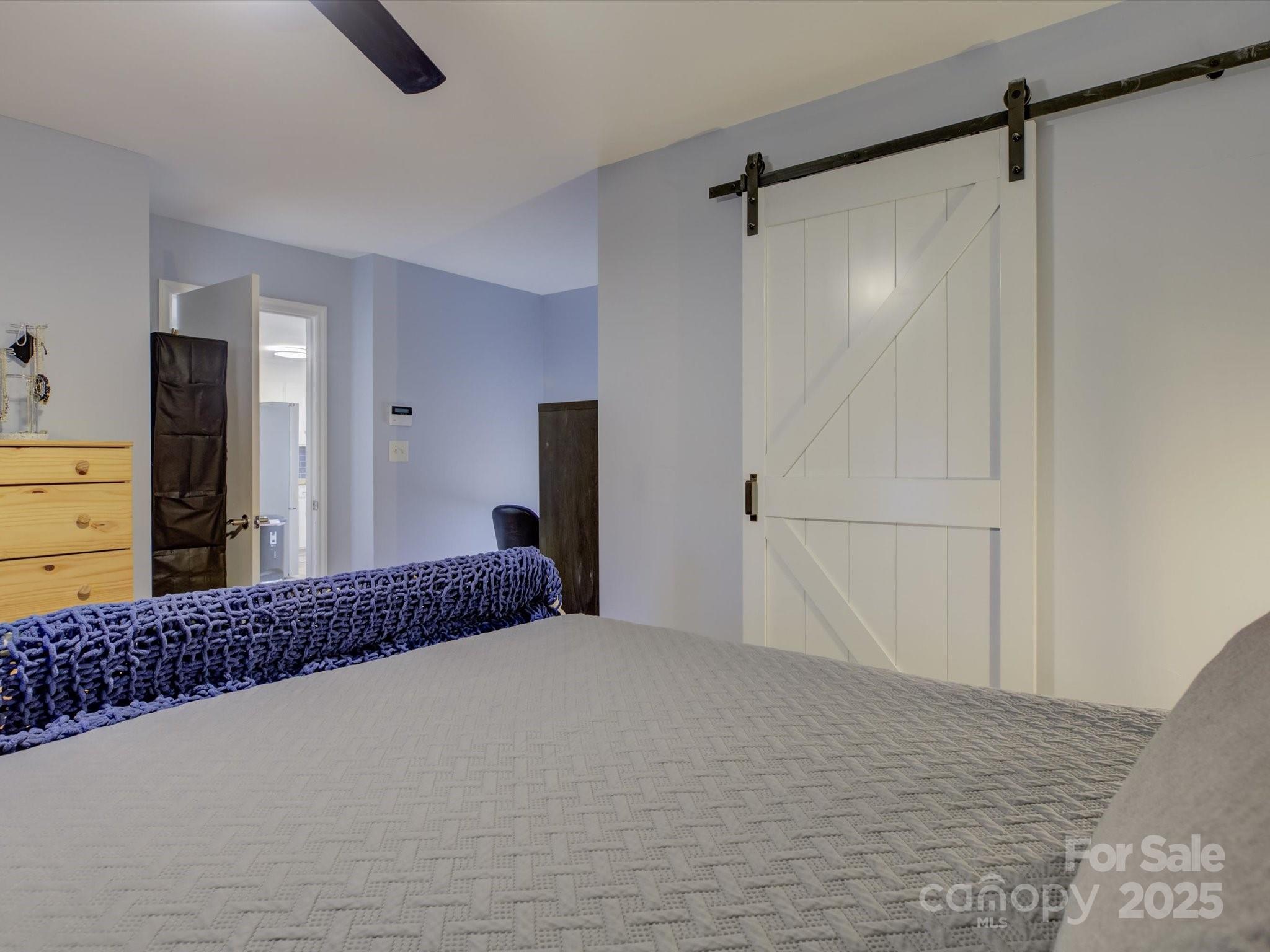 228 Ridge Drive Harrisburg, NC 28075 - Photo 15 of 27 a bedroom with a bed and a dresser in it