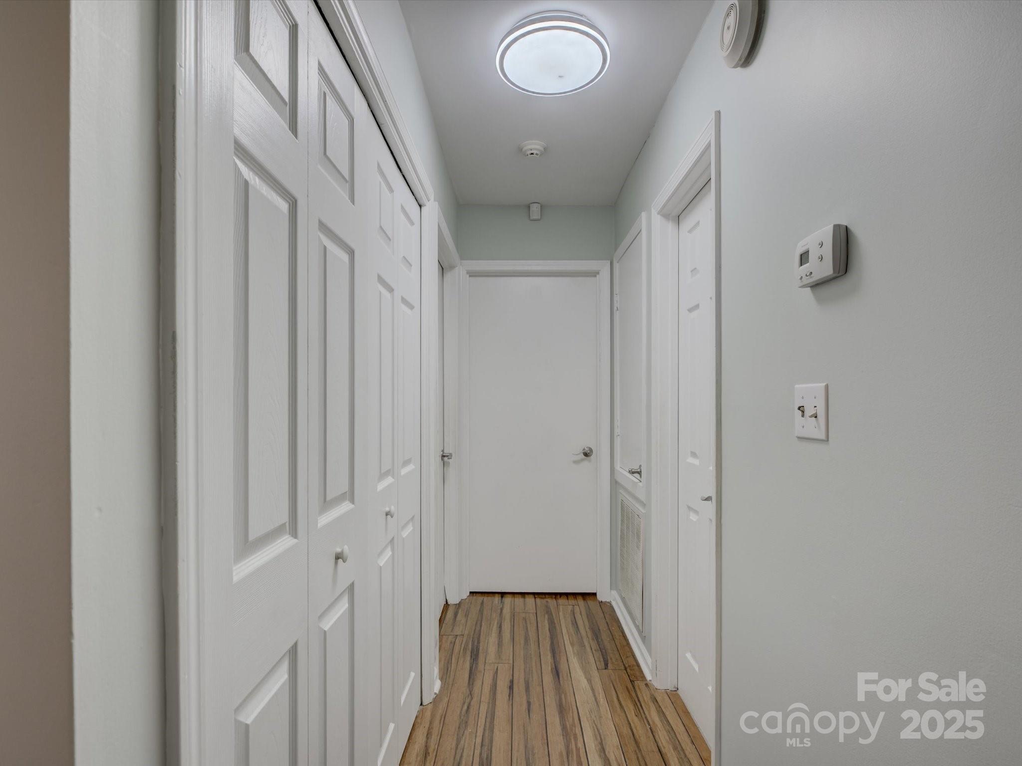 228 Ridge Drive Harrisburg, NC 28075 - Photo 18 of 27 a view of a hallway with wooden floor