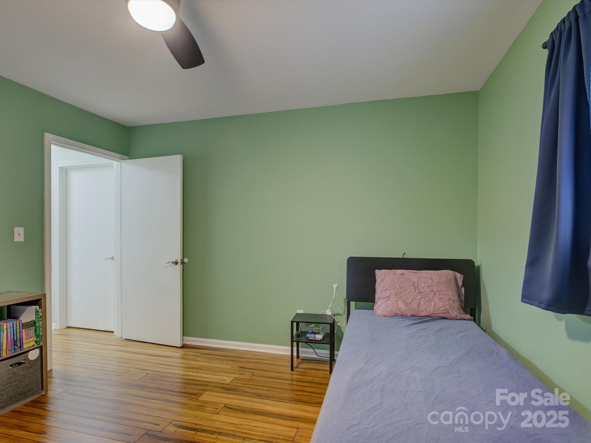 228 Ridge Drive Harrisburg, NC 28075 - Photo 20 of 27 a bedroom with a bed and wooden floor