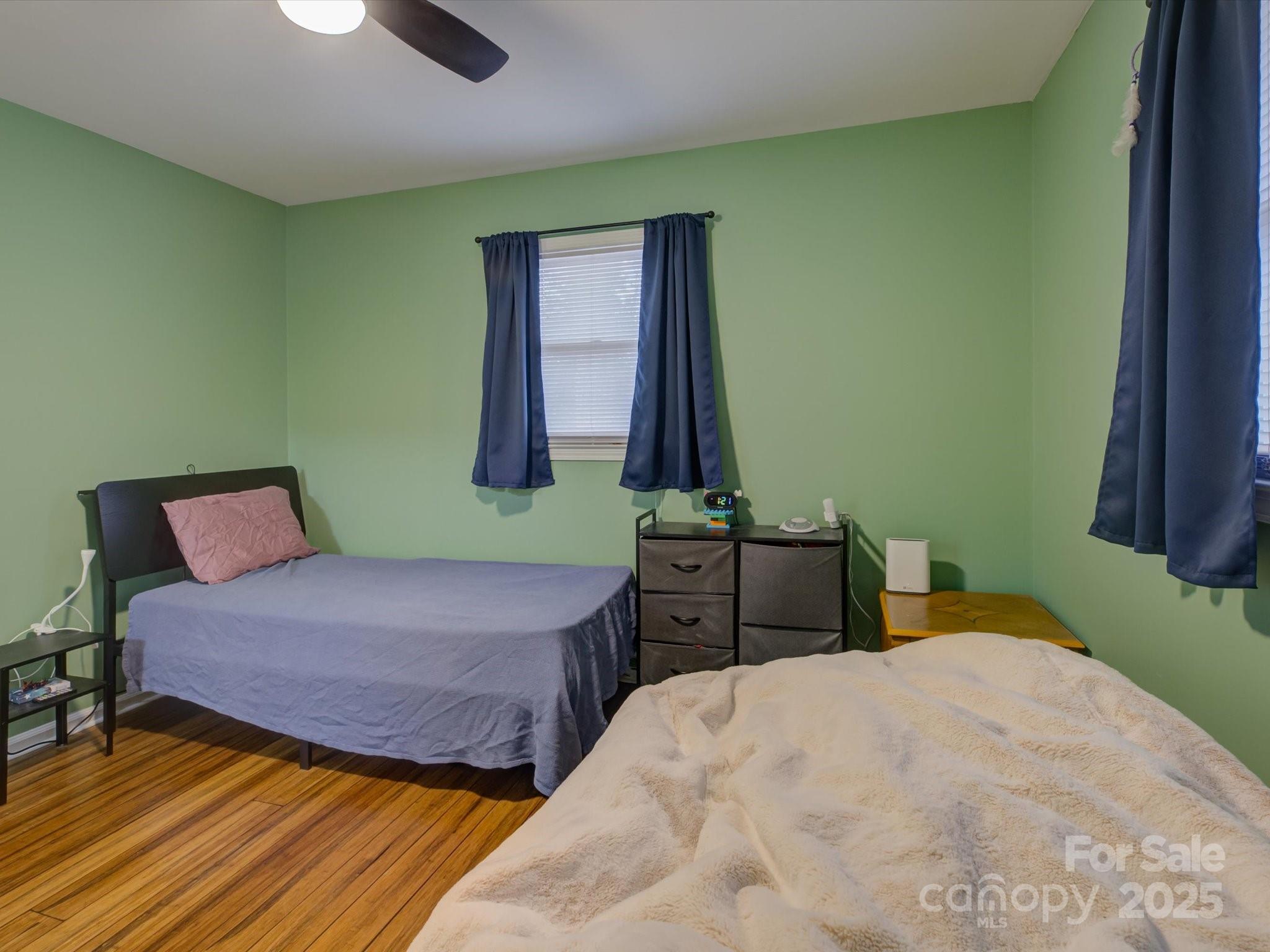 228 Ridge Drive Harrisburg, NC 28075 - Photo 21 of 27 a bedroom with a bed and a dresser