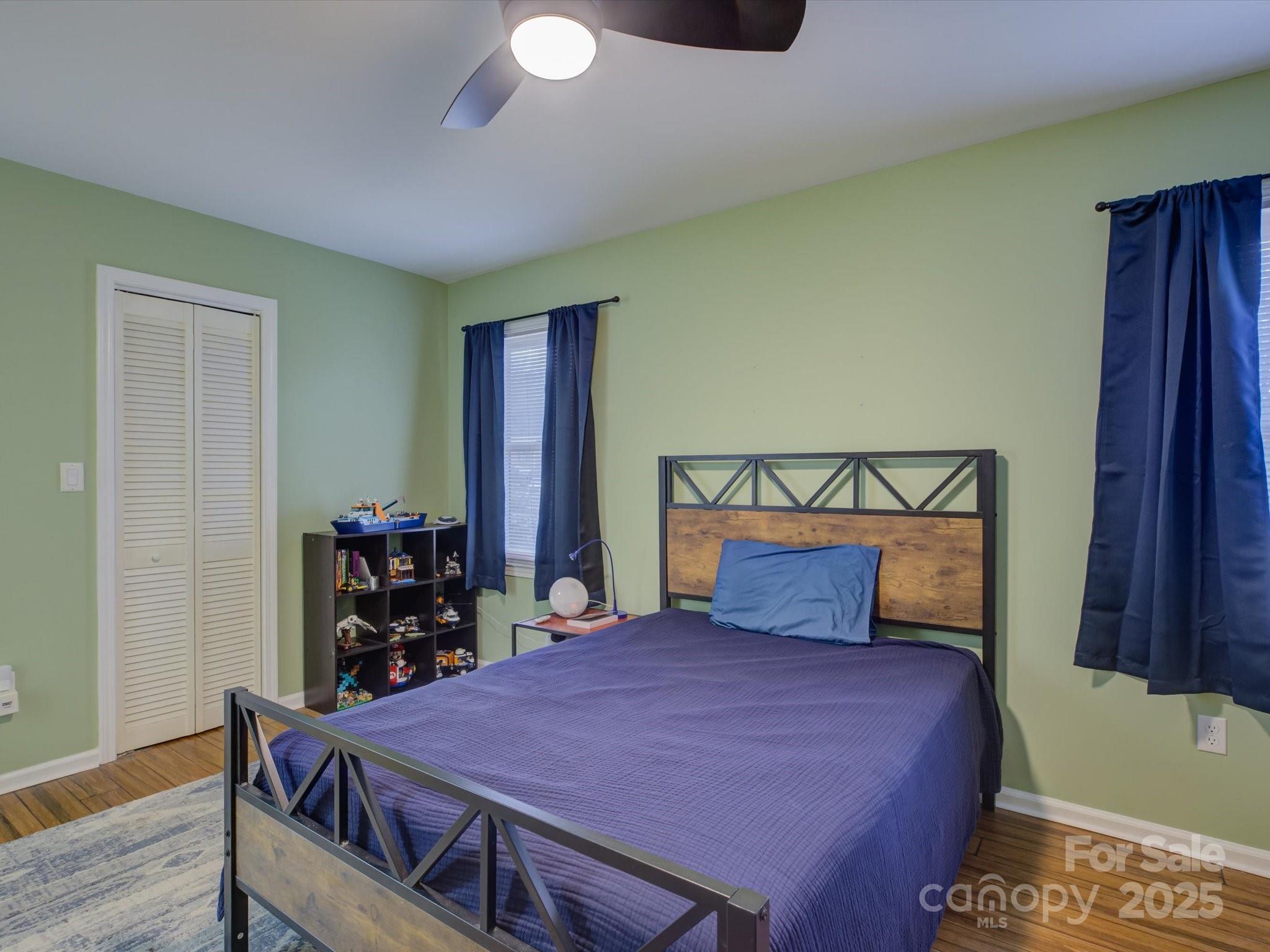 228 Ridge Drive Harrisburg, NC 28075 - Photo 22 of 27 a bedroom with a bed and a table