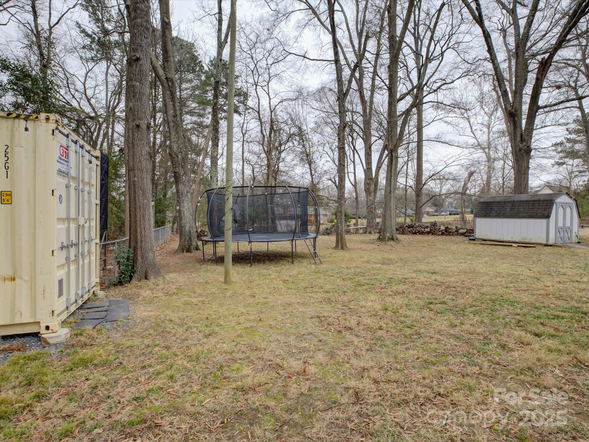 228 Ridge Drive Harrisburg, NC 28075 - Photo 26 of 27 a view of a yard with large trees