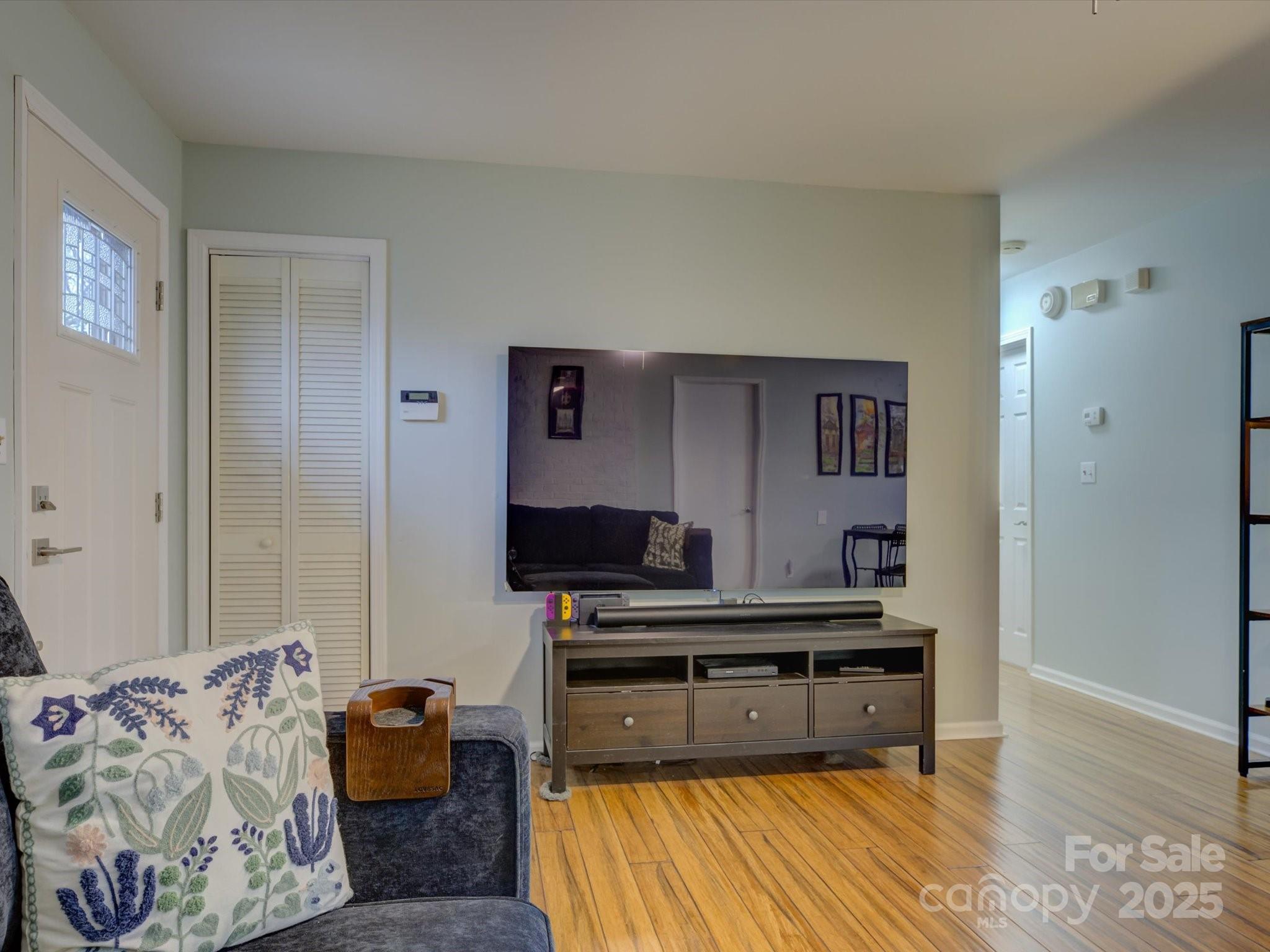 228 Ridge Drive Harrisburg, NC 28075 - Photo 7 of 27 a living room with furniture and a flat screen tv
