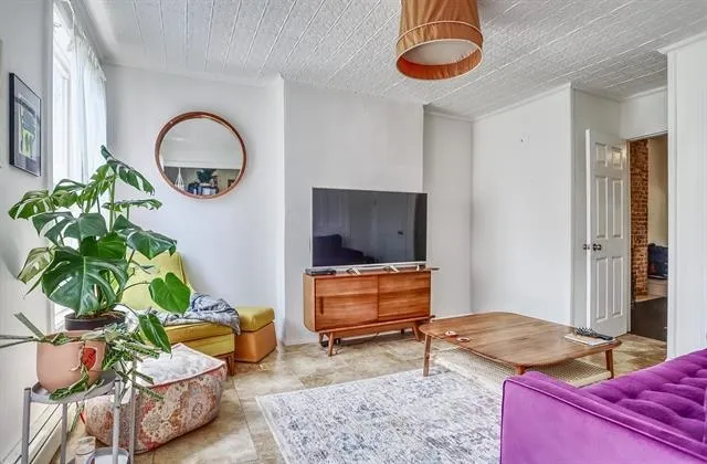 a living room with furniture and a rug