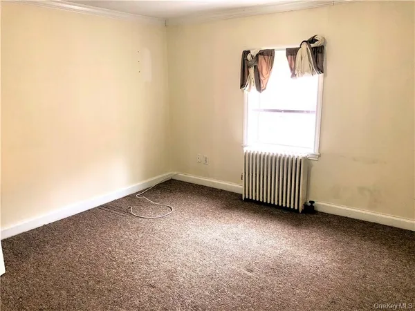 a view of a room with a window