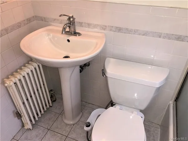 a bathroom with a toilet and a sink