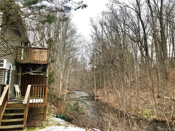 a view of a house with a tree