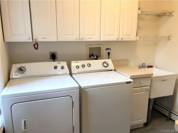 a utility room with dryer and washer