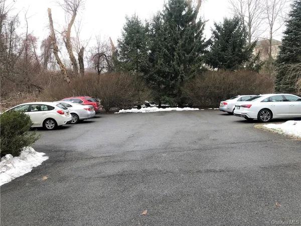 a view of street with parked cars