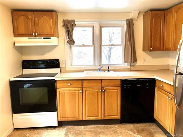 a kitchen with a stove and a sink