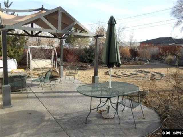 650 Hood Avenue Reno, NV 89512 - Photo 11 of 12 a backyard of a house with table and chairs