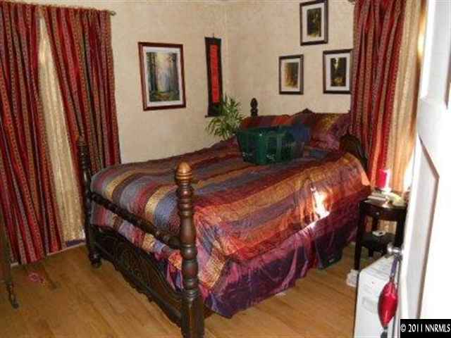 650 Hood Avenue Reno, NV 89512 - Photo 5 of 12 a bed sitting in a bedroom next to a window
