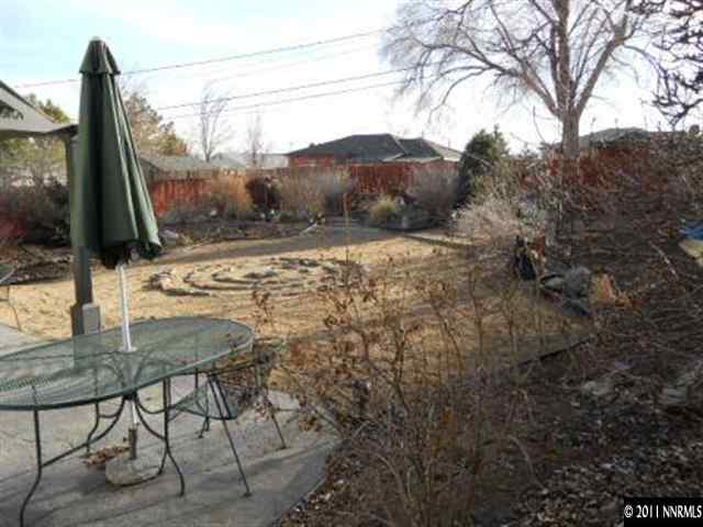 650 Hood Avenue Reno, NV 89512 - Photo 10 of 12 a view of a mountain from a yard
