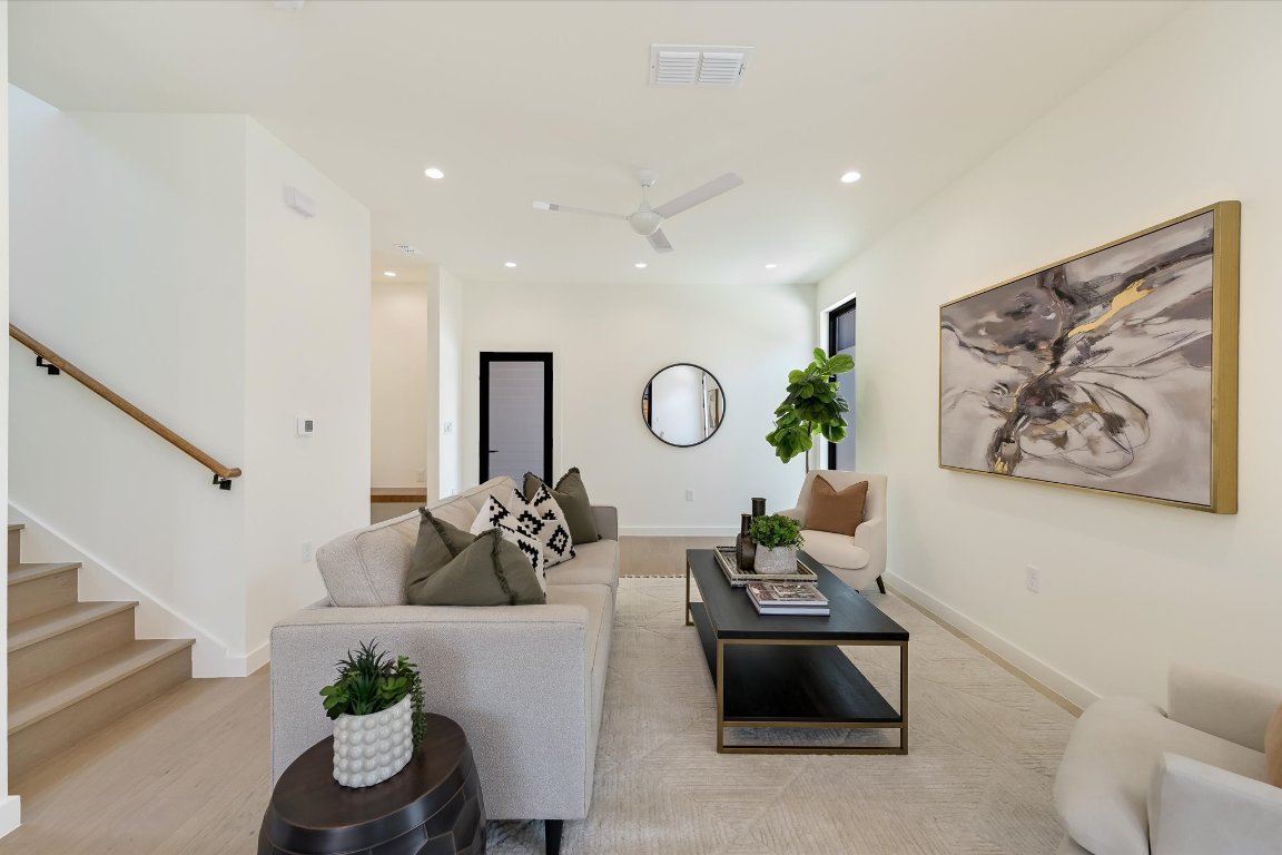 2705 Francisco Street, Unit A Austin, TX 78702 - Photo 3 of 21 Living area featuring recessed lighting, a ceiling fan, and stairs