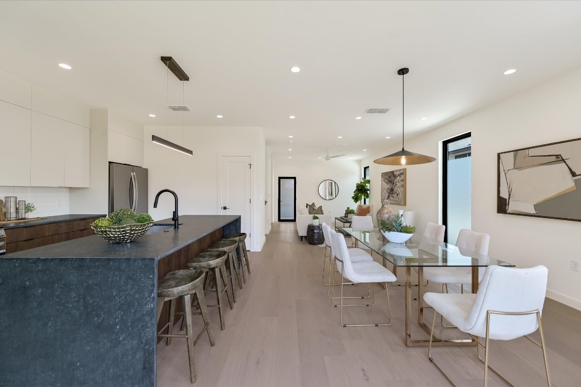 2705 Francisco Street, Unit A Austin, TX 78702 - Photo 8 of 21 Dining area with light wood finished floors and recessed lighting