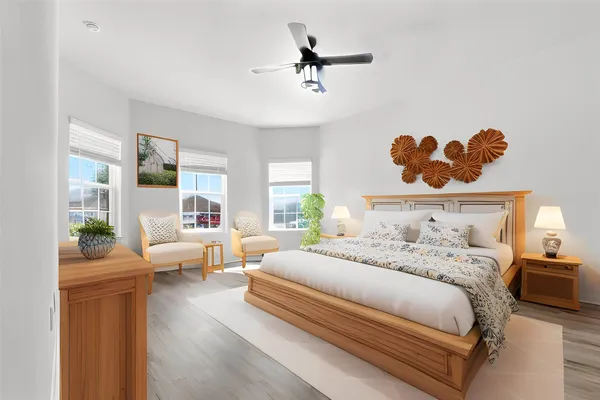 a bedroom with double bed and a couch