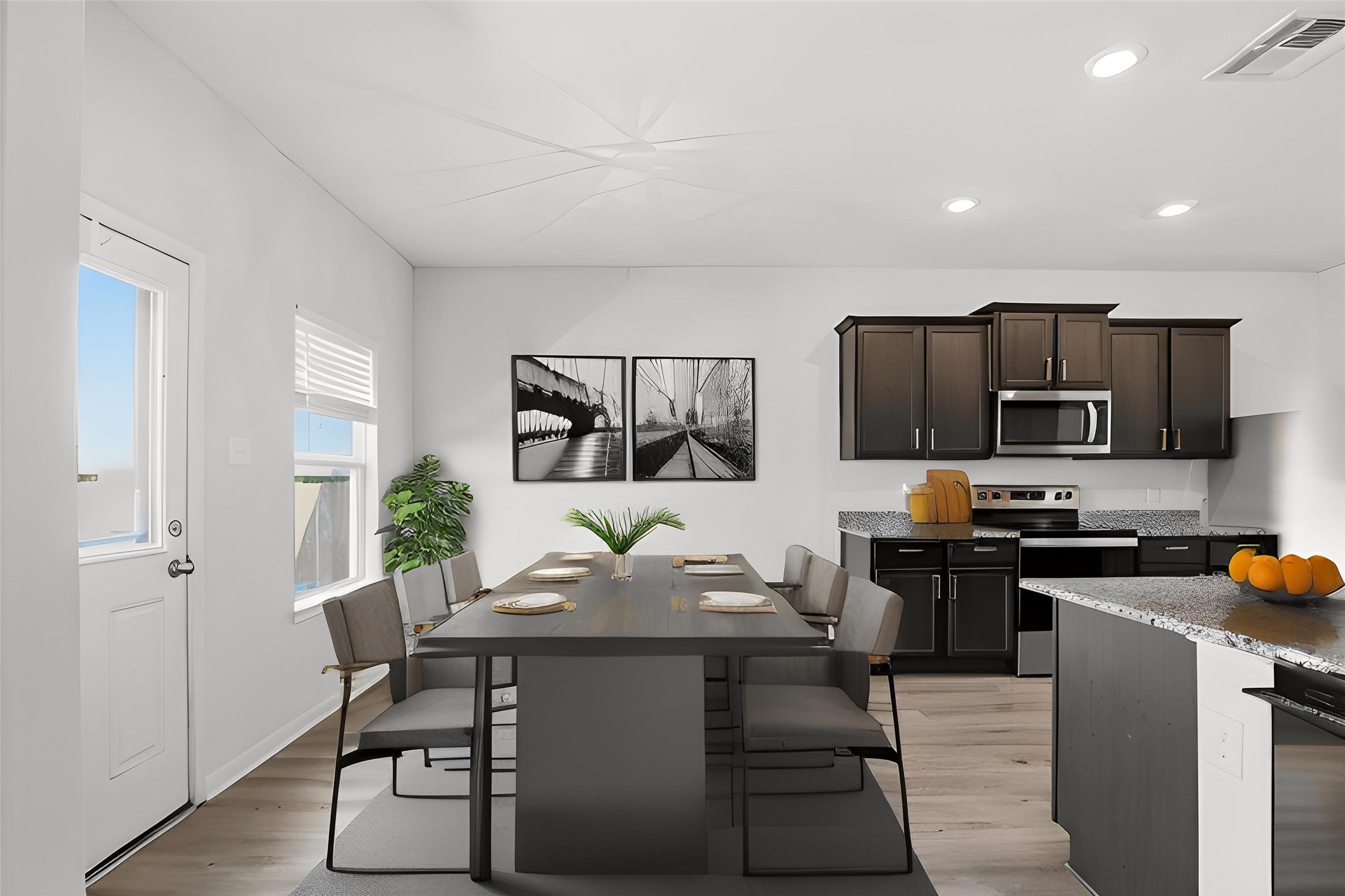 2044 Mule Ridge Drive Katy, TX 77493 - Photo 12 of 38 a kitchen with stainless steel appliances a stove a sink a microwave a refrigerator and cabinets