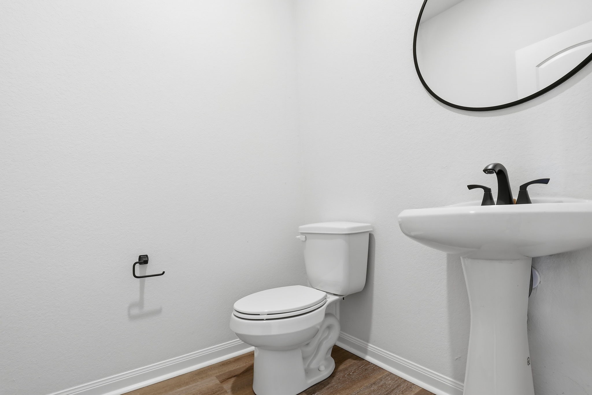 2044 Mule Ridge Drive Katy, TX 77493 - Photo 18 of 38 a bathroom with a sink a mirror and a toilet