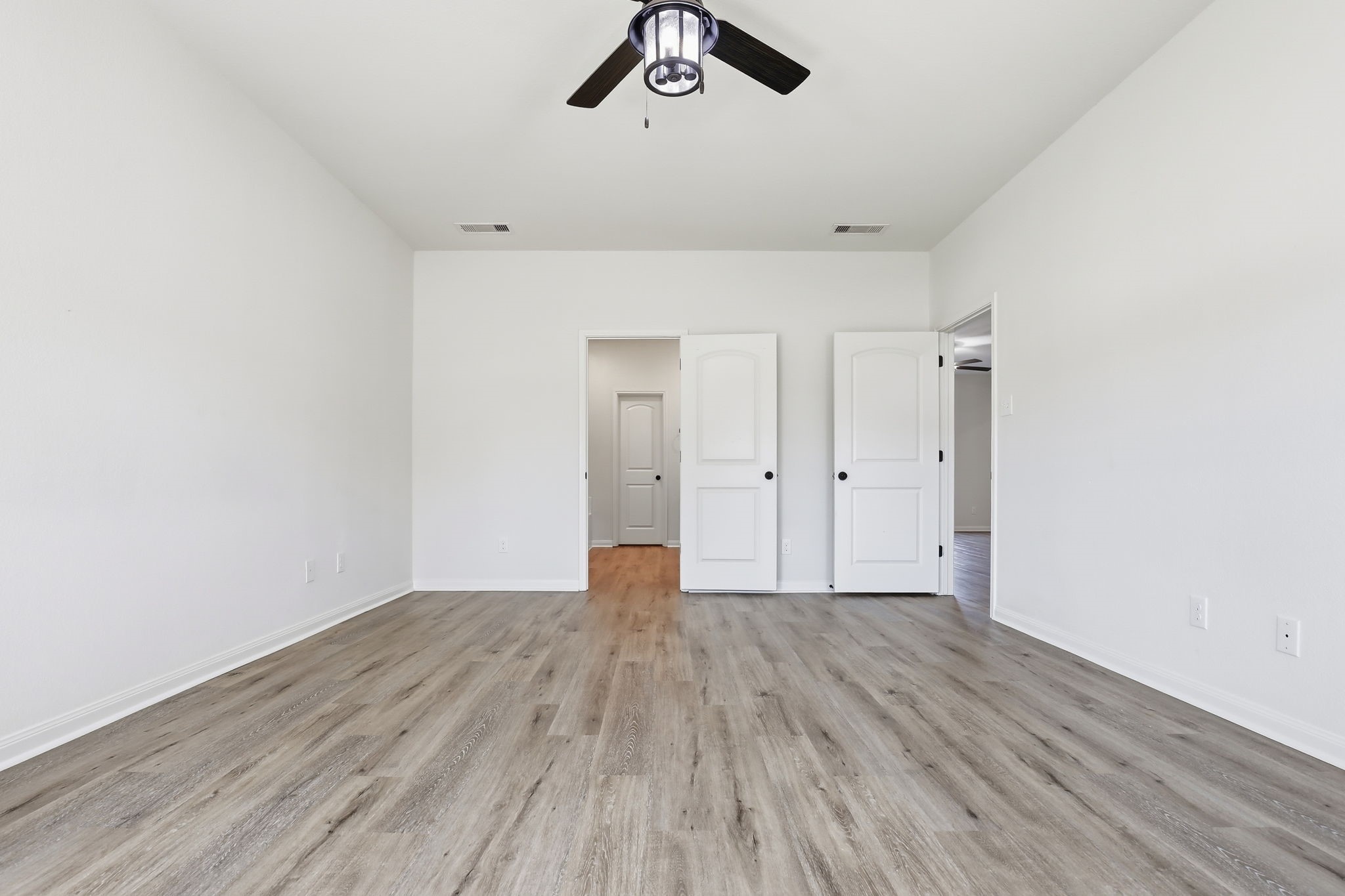 2044 Mule Ridge Drive Katy, TX 77493 - Photo 20 of 38 a view of an empty room with wooden floor