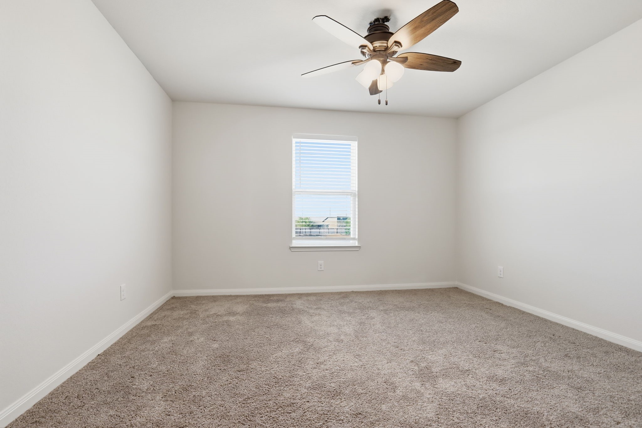 2044 Mule Ridge Drive Katy, TX 77493 - Photo 26 of 38 an empty room with a window and a fan