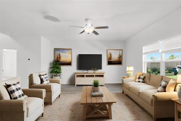 a living room with furniture and a flat screen tv
