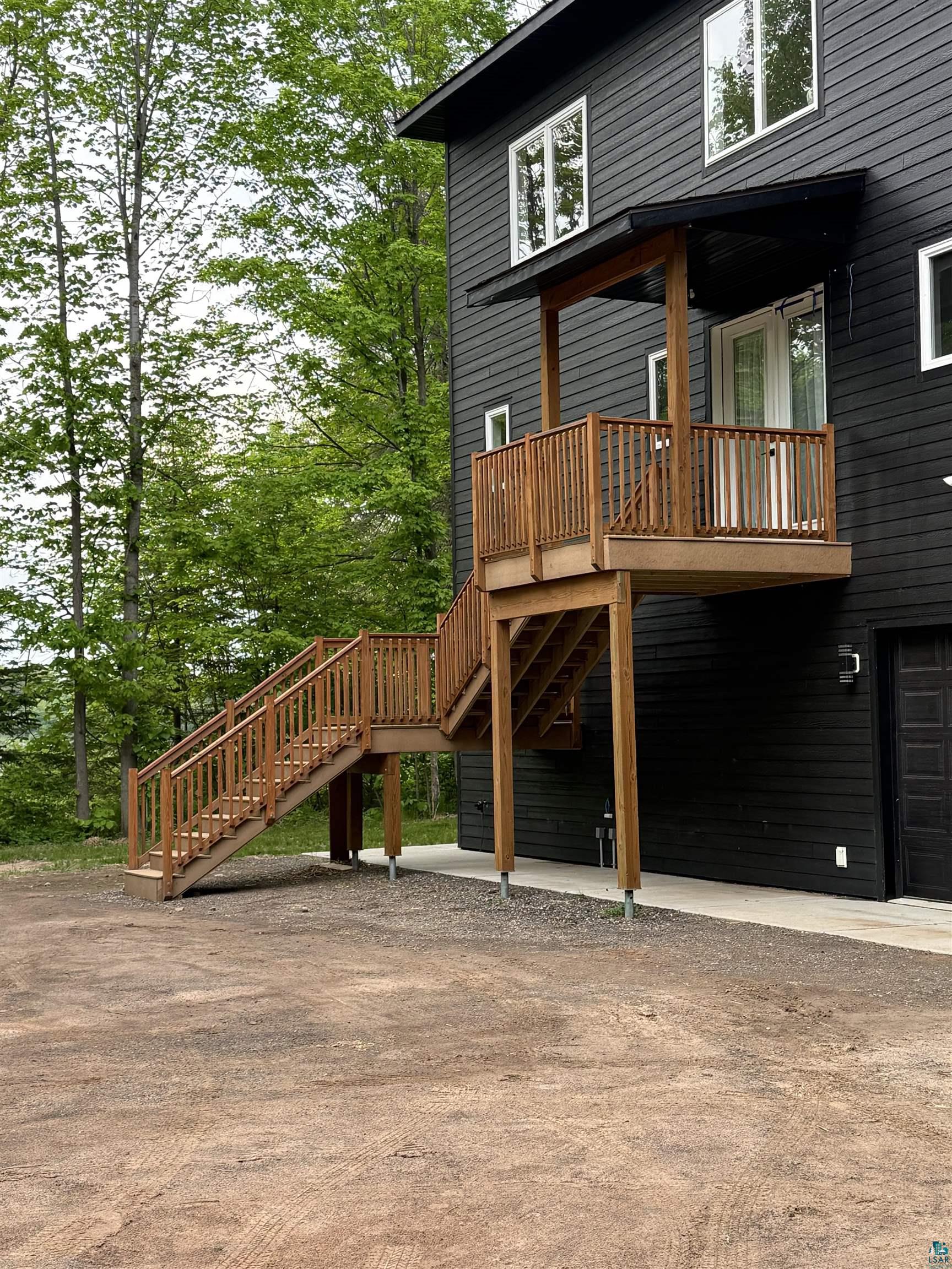 2000 West Chub Lake Road Carlton, MN 55718 - Photo 27 of 30 Exterior facade with dark siding and white-framed windows