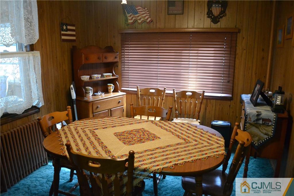 1526 Englishtown Road Old Bridge, NJ 08857 - Photo 2 of 6 a dining table with chairs and table