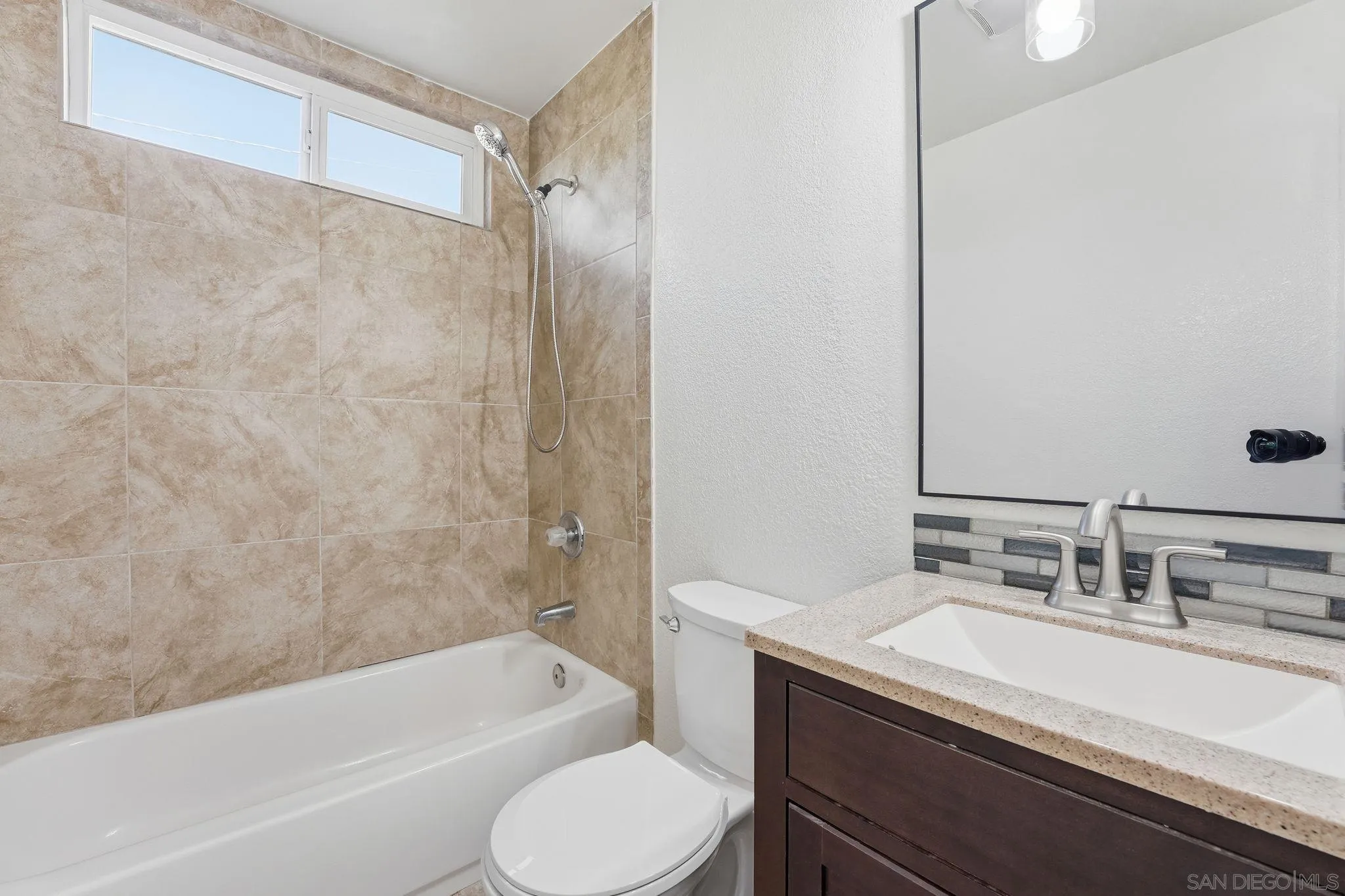 12621 Lindo Lane Lakeside, CA 92040 - Photo 24 of 28 a bathroom with a granite countertop sink toilet and shower