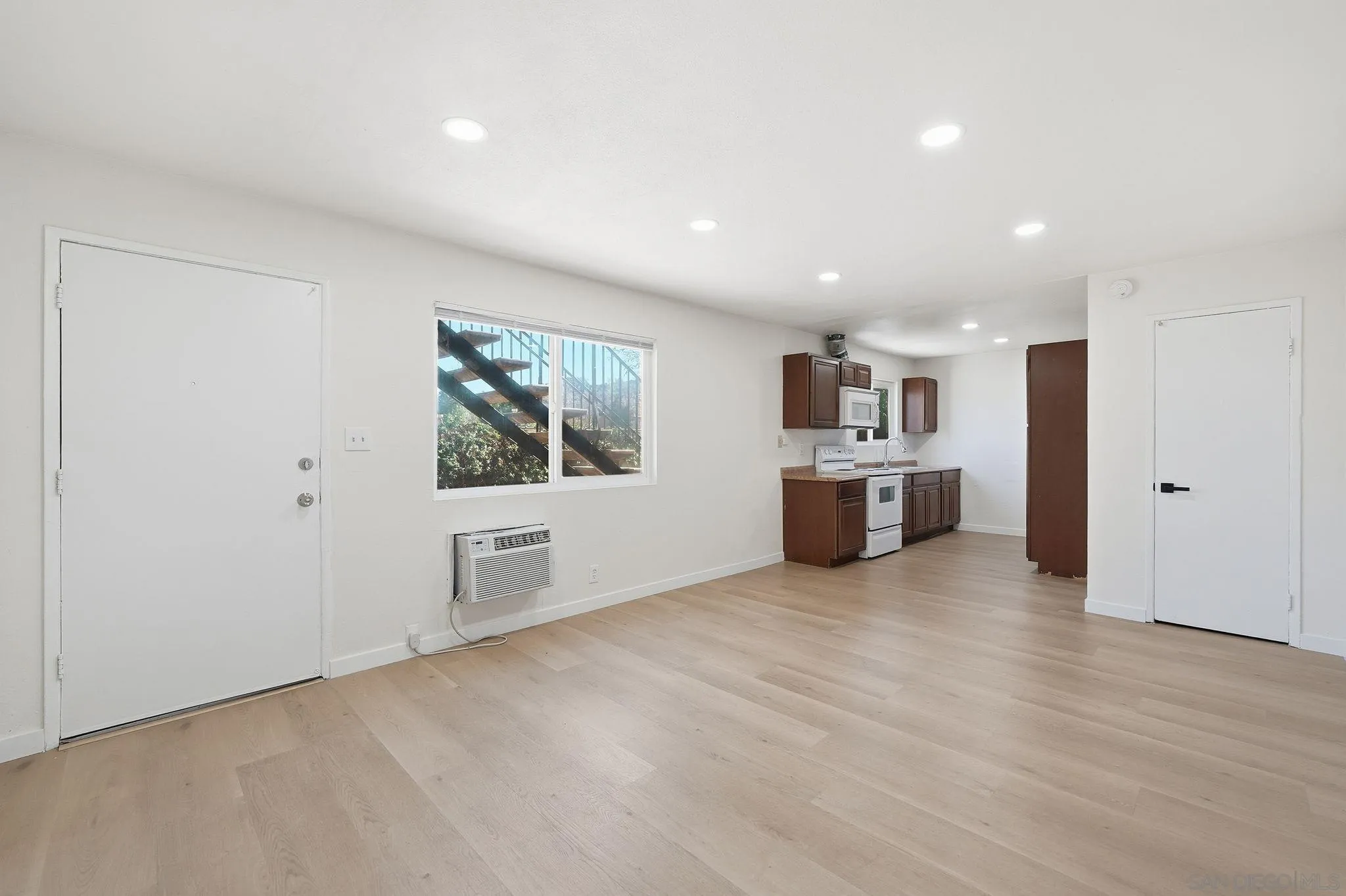 12621 Lindo Lane Lakeside, CA 92040 - Photo 6 of 28 a view of a kitchen with a sink cabinets and wooden floor