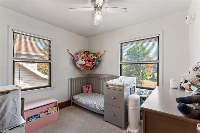 a bedroom with furniture and a window