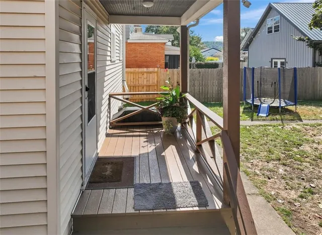 a view of balcony with furniture