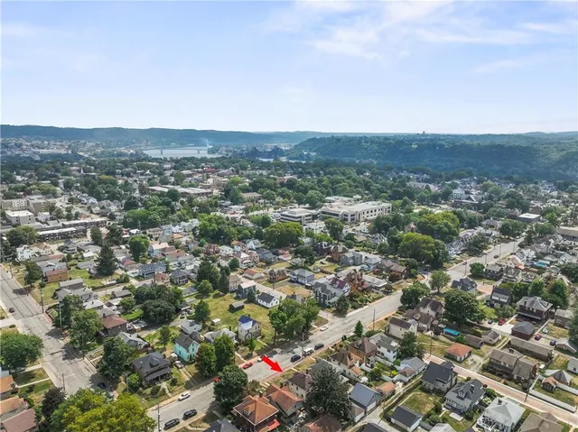 an aerial view of residential house and green space