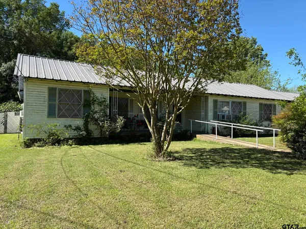a house with trees in front of it