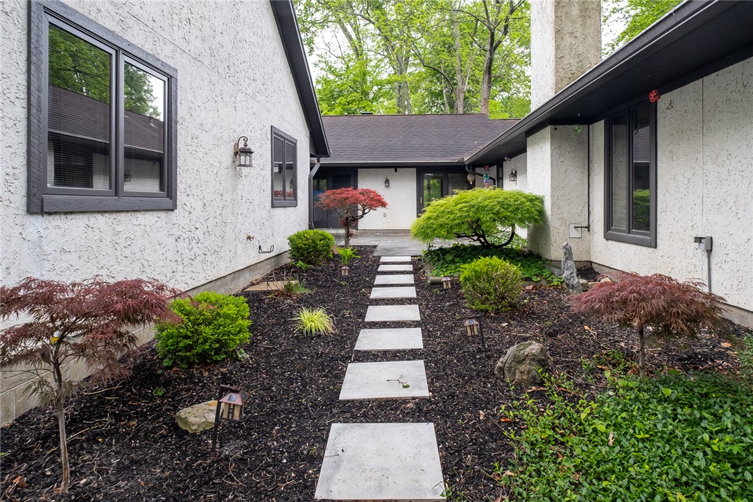 273 North Alpha Bellbrook Road Dayton, OH 45434 - Photo 42 of 43 This outdoor space offers a charming stone path leading to the entrance, surrounded by lush greenery.