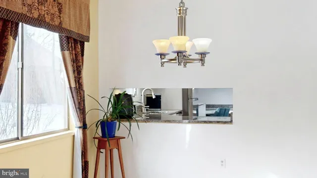 a view of living room with furniture and a window