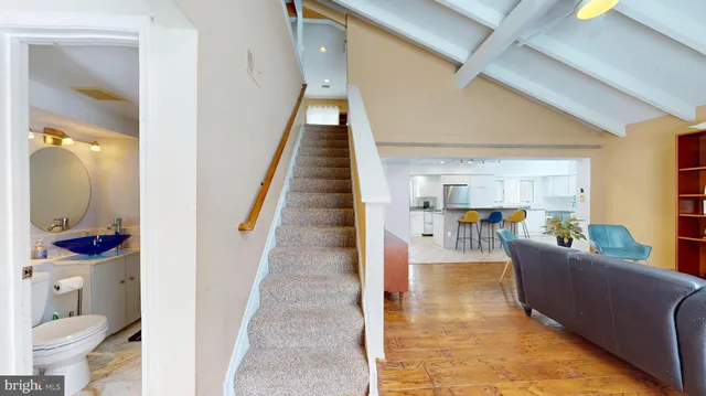 a living room with furniture and a rug