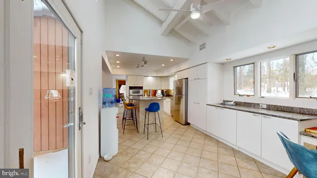 a view of a kitchen with furniture and a window