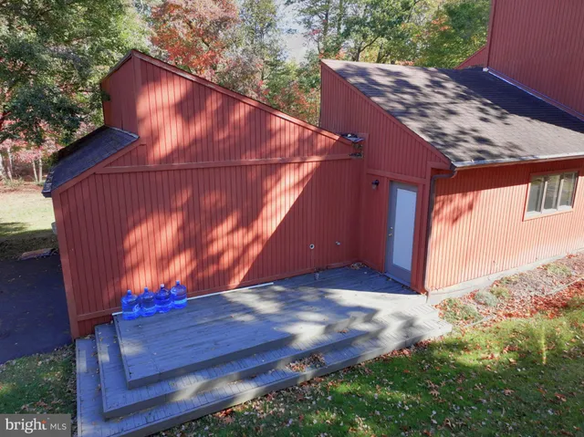 a view of a backyard with a tree