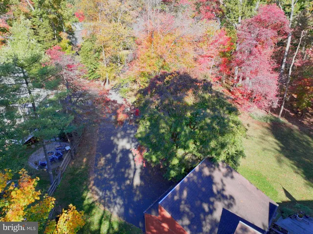 a backyard of a house with a yard and outdoor seating