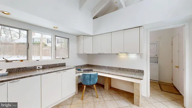 a kitchen that has a sink and a stove in it