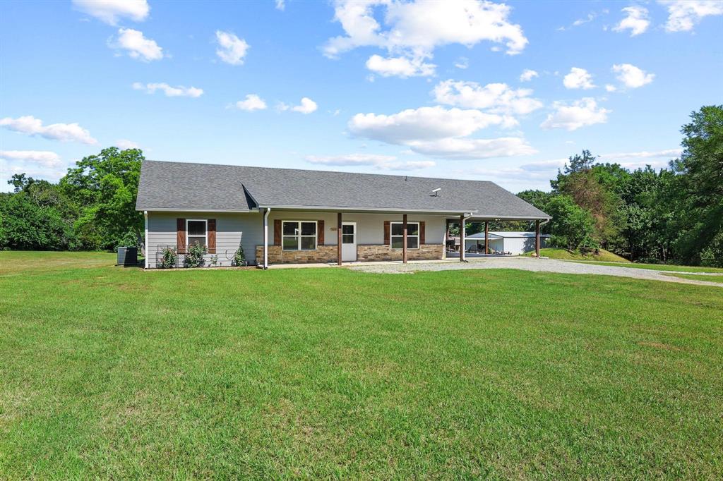 2658 Oak Ridge Road Denison, TX 75021 - Photo 3 of 37 a view of house with a yard