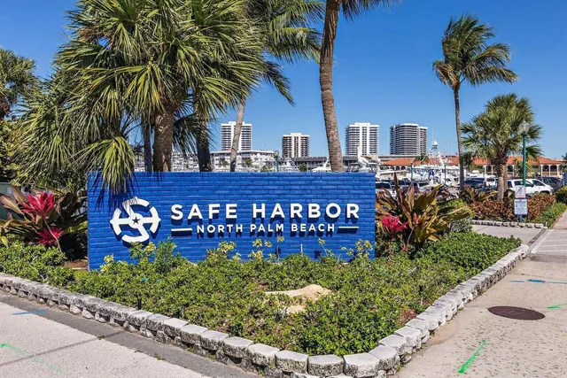 a wooden bench sitting in front of a building