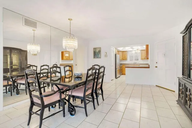 a view of swimming pool with a table and chairs