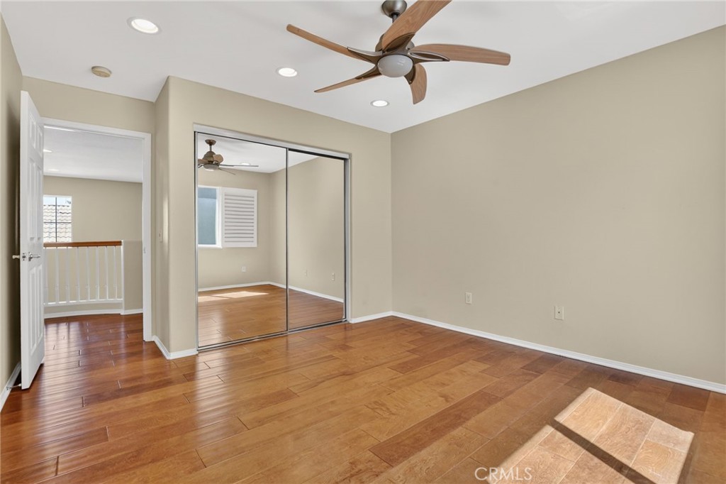 20543 Pesaro Porter Ranch Porter Ranch, CA 91326 - Photo 53 of 67 an empty room with wooden floor and door