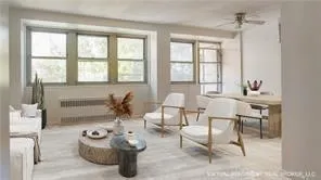 a living room with furniture and a large window