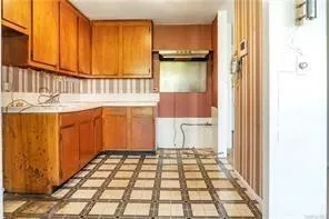 a view of a utility room with a sink