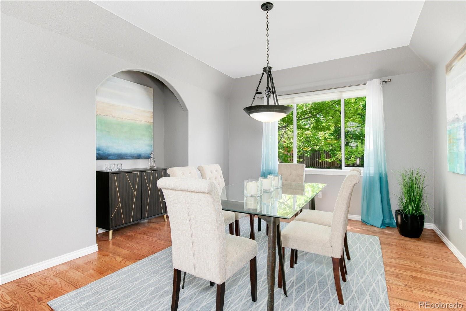 9318 Reed Way Broomfield, CO 80021 - Photo 6 of 33 a view of a dining room with furniture window and wooden floor